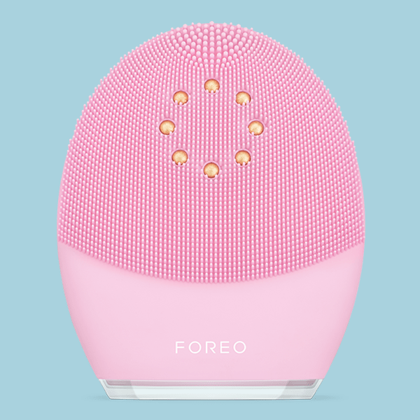 Pink FOREO Luna facial cleansing brush.