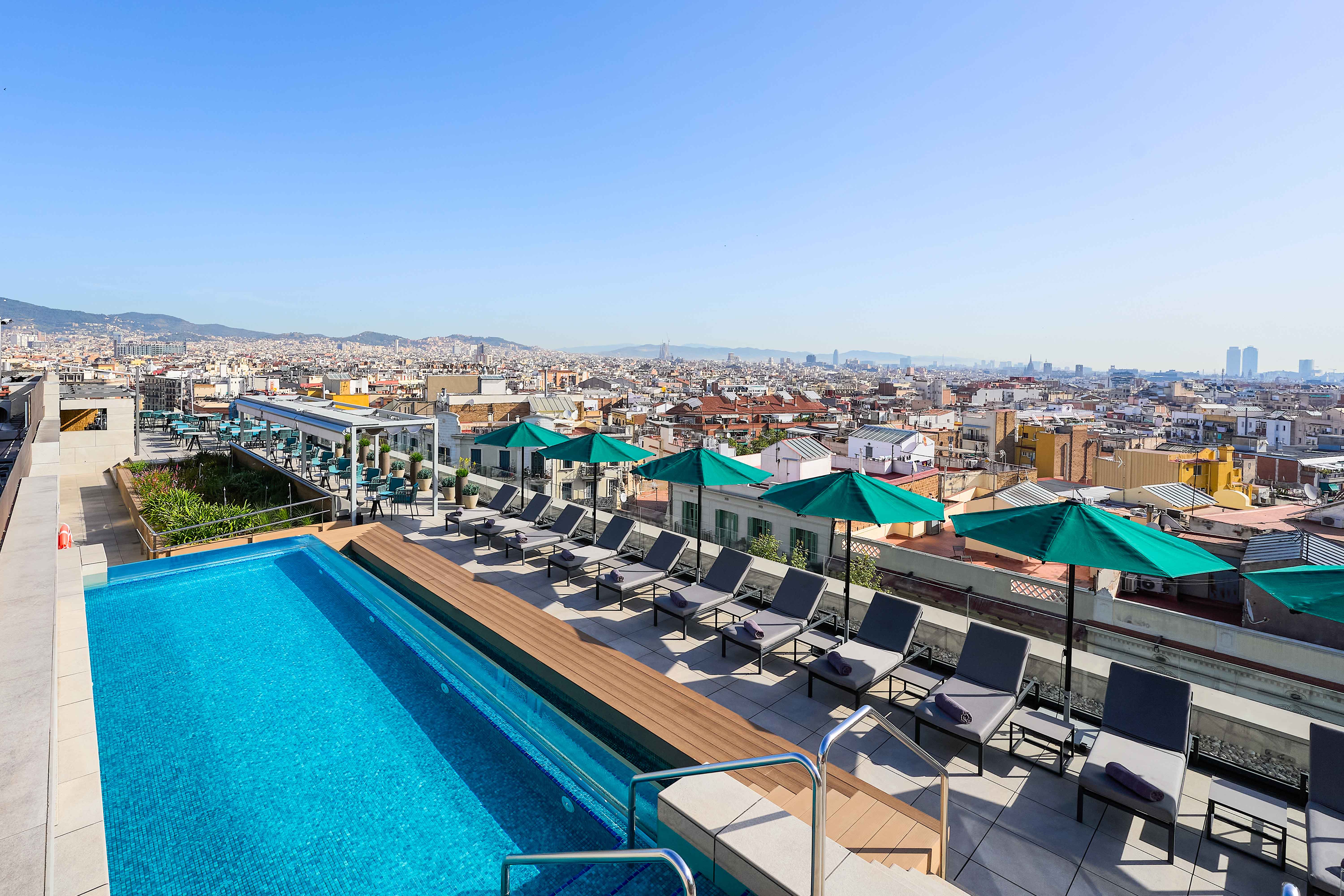 The rooftop pool and views over the city at Intercontinental Barcelona hotel, Spain