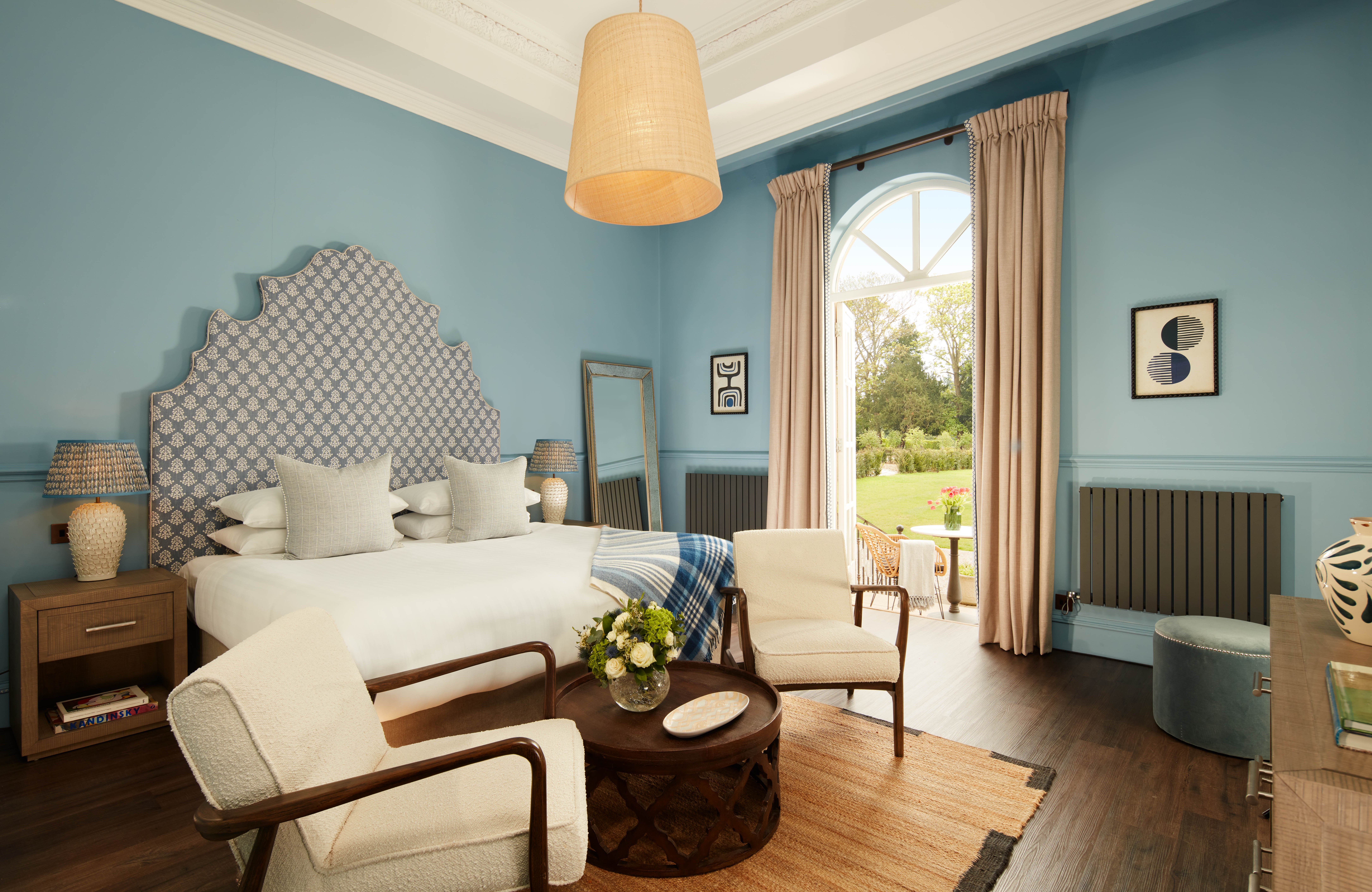 Hotel room featuring a king-size bed and garden view.
