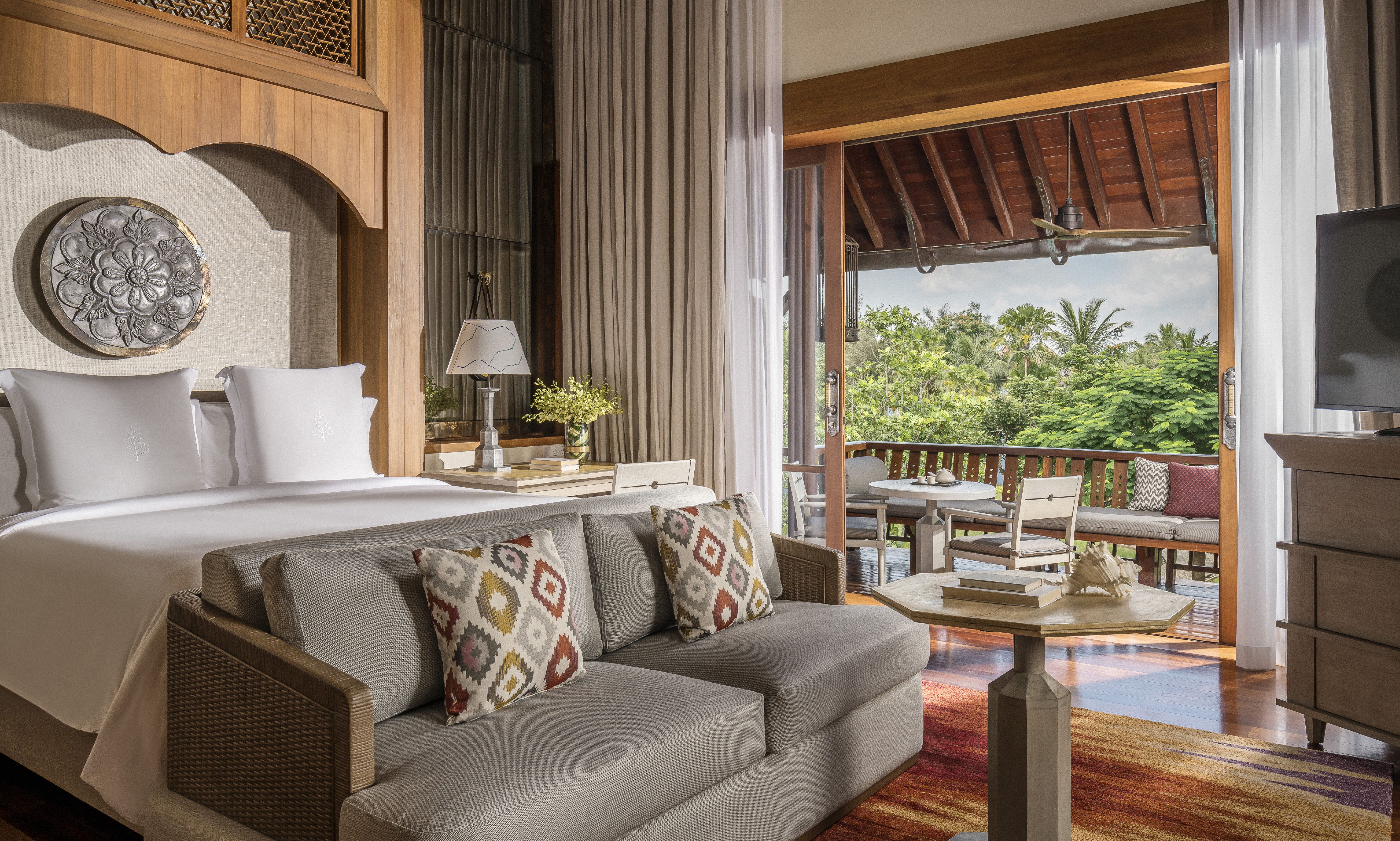 Four Seasons Resort Langkawi bedroom with view of patio.