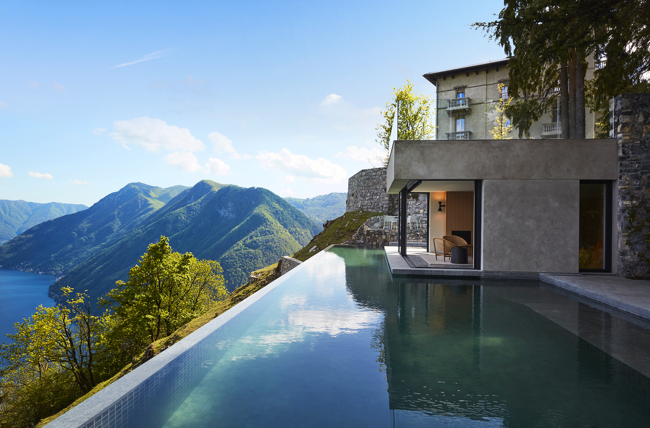 Infinity pool overlooking Lake Como and mountains.
